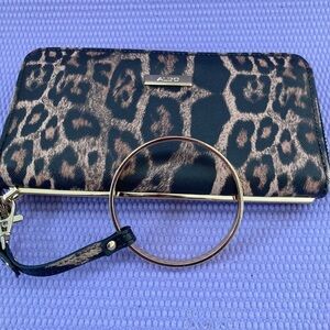 Cheetah Print 
ALDO Animal Print wallet With Detachable Strap Gold Colored ring